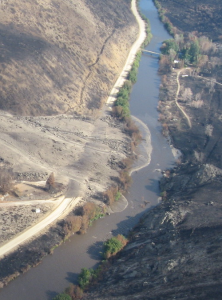 Post-wildfire mudslide into the South Fork Boise River just upstream of Reclamation Village.